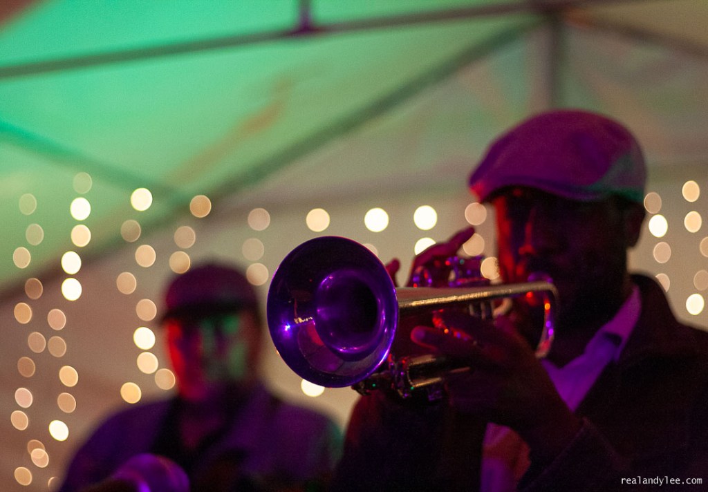 Black man playing trumpet on stage