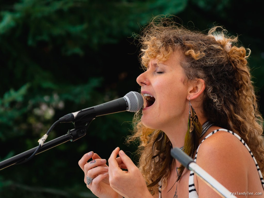 Woman singing into mic