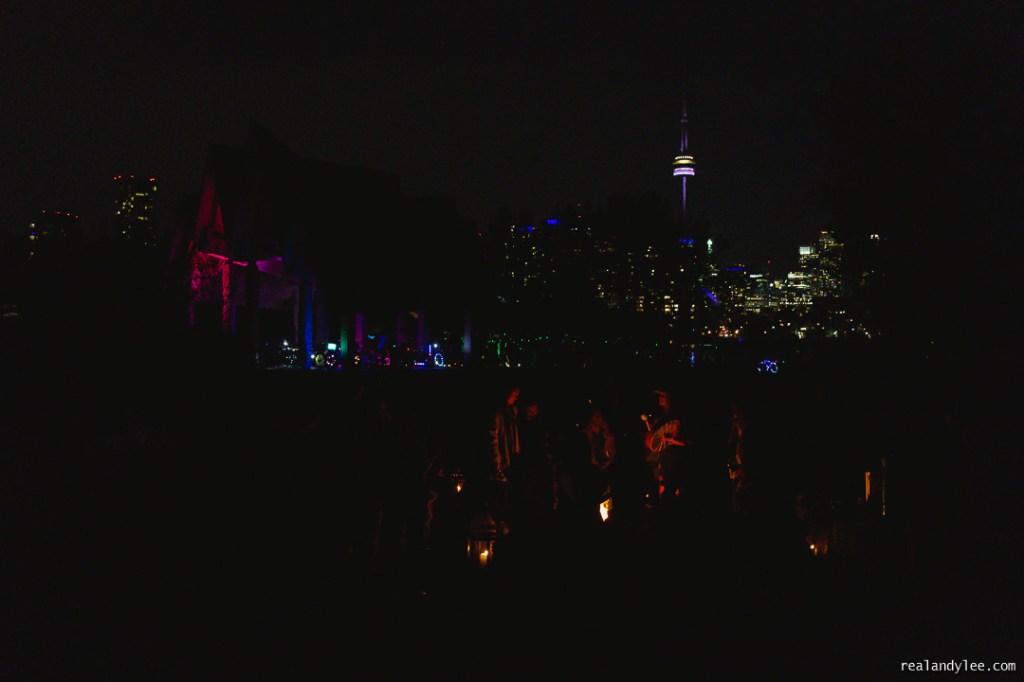 People gather around a ceremonial fire during a Chocolate Groove silent disco at Trillium Park in October 2021. © Andy Lee, realandylee.com