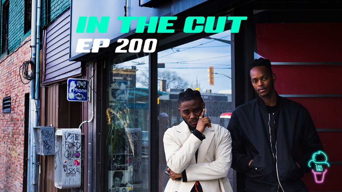 Two Black men standing outside Amp Studio Cafe