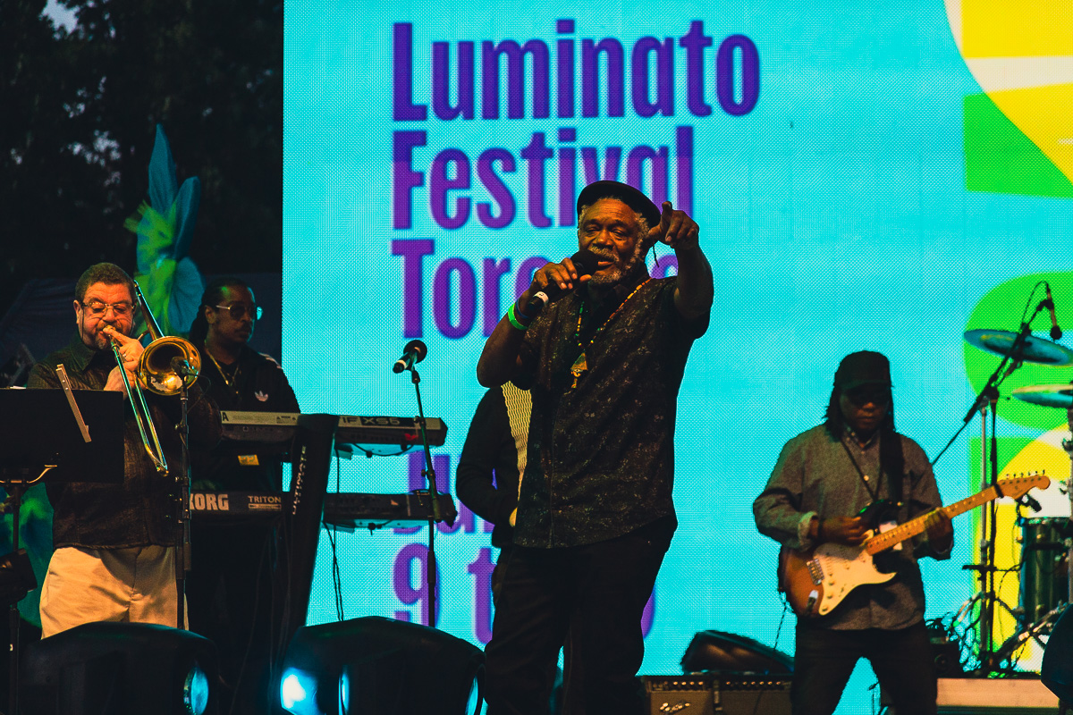 Black reggae artist Horace Andy performs on an outdoor stage at Luminato Festival. © Andy Lee, 2022. realandylee.com