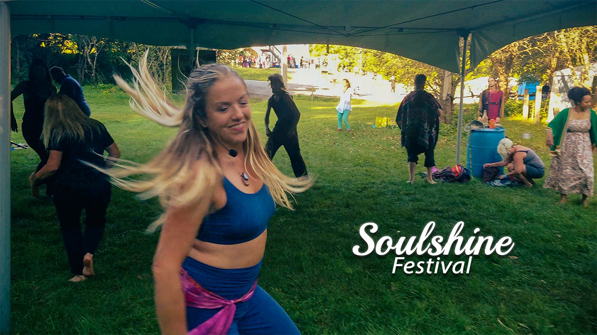 Blonde woman dancing outside at festival