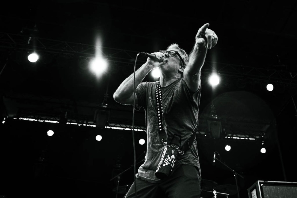 Descendents frontman Milo Aukerman singing and pointing